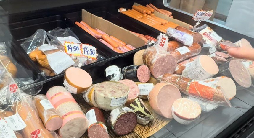 Belarusian sausages and other meat products displayed at a grocery store in central Baku