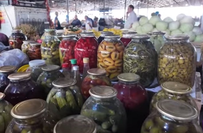 Jars of homemade pickled vegetables at a market in Azerbaijan