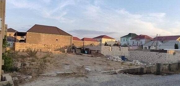 Residential homes in a Baku suburb near a planned railway route