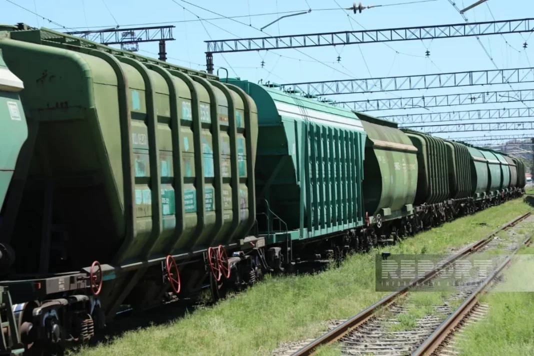 Freight train carrying goods on railway tracks