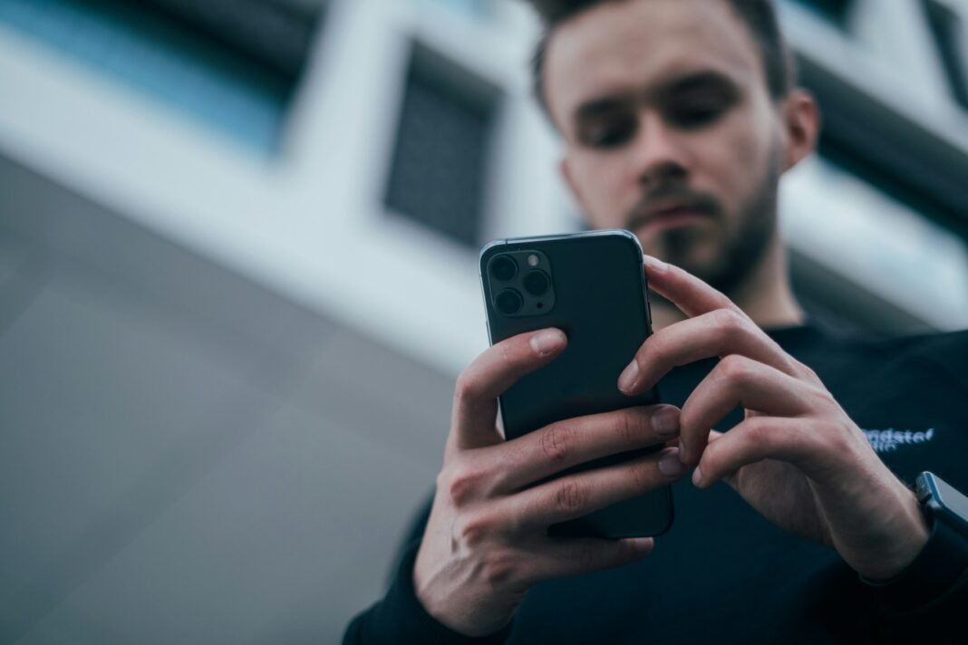 Entrepreneur reviewing business finances on a smartphone
