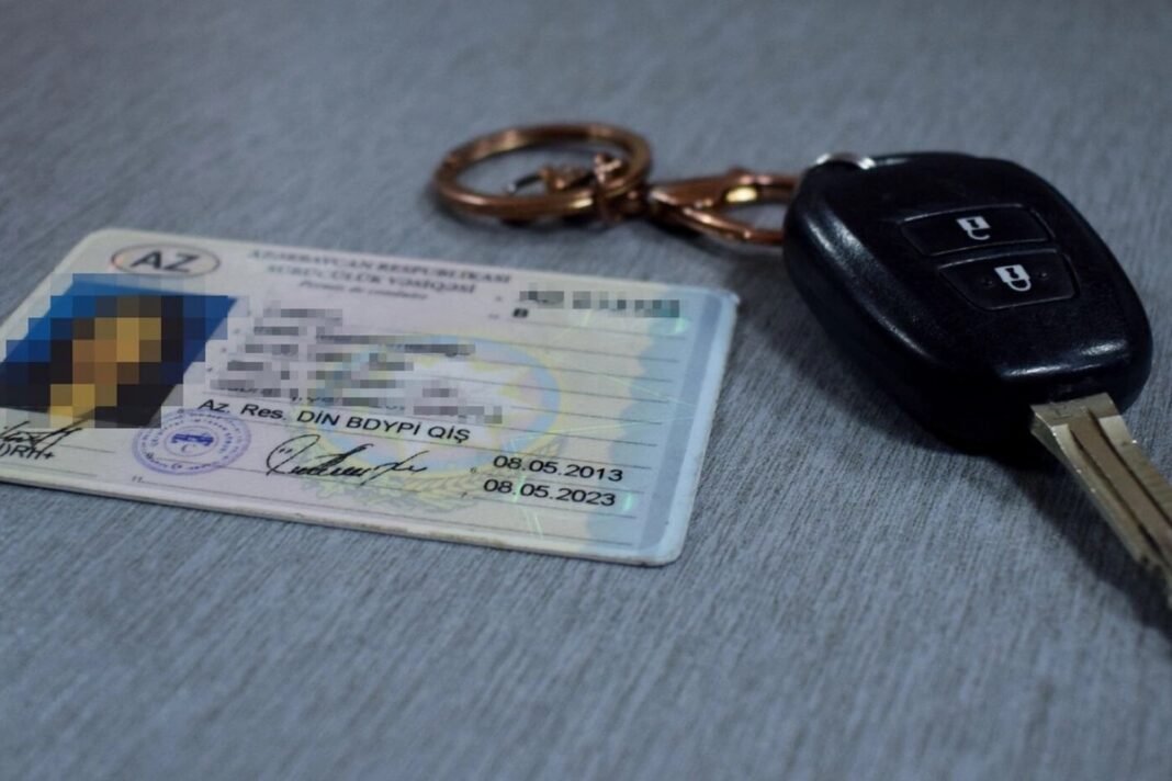 Azerbaijani driver’s license beside a car key