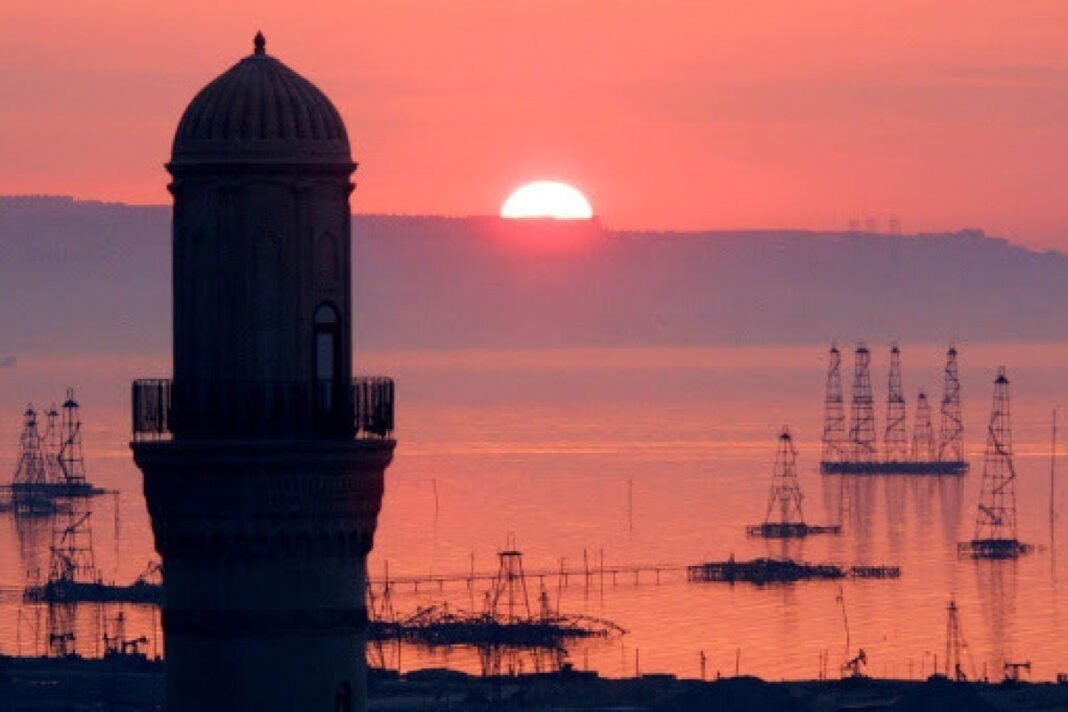 Oil rigs in the Caspian Sea at sunset
