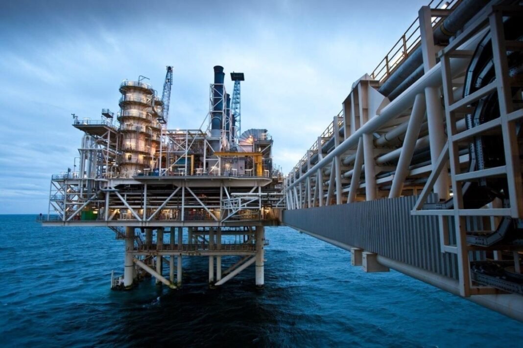 Oil pumpjack against the flag of Azerbaijan