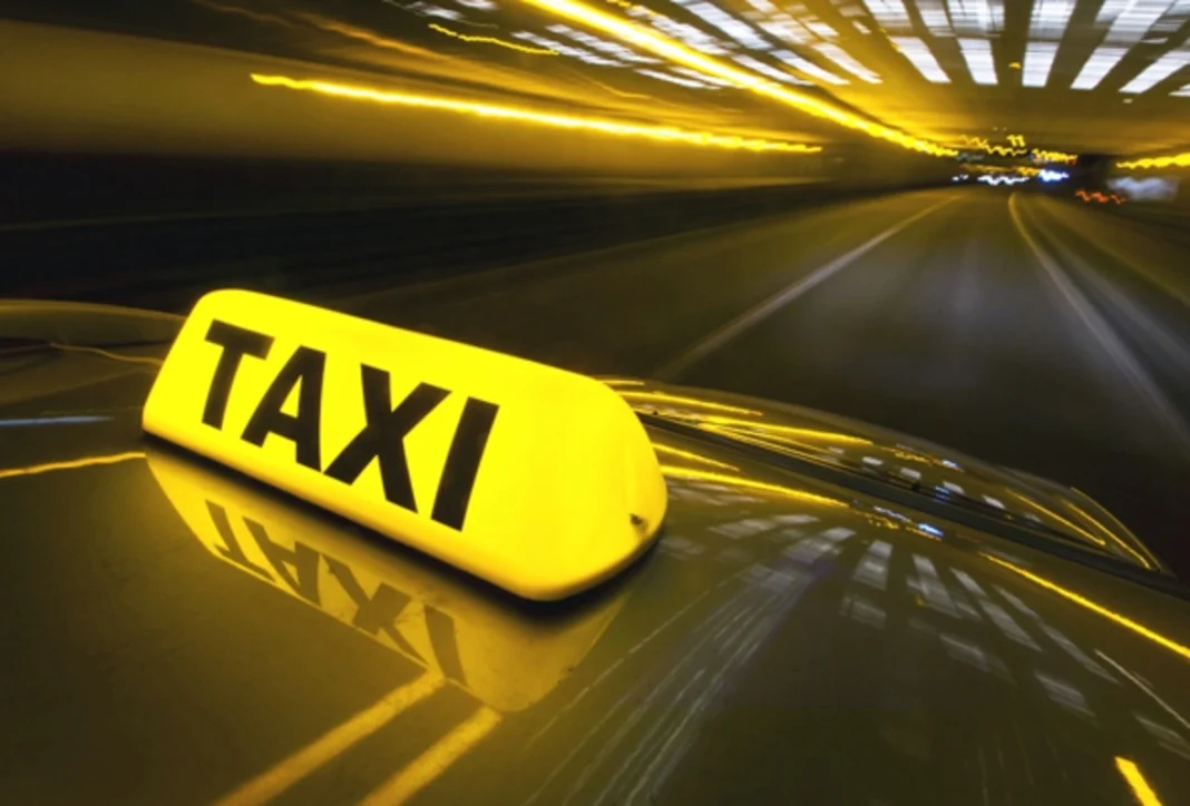 Shared taxis waiting for passengers near a Baku transport hub