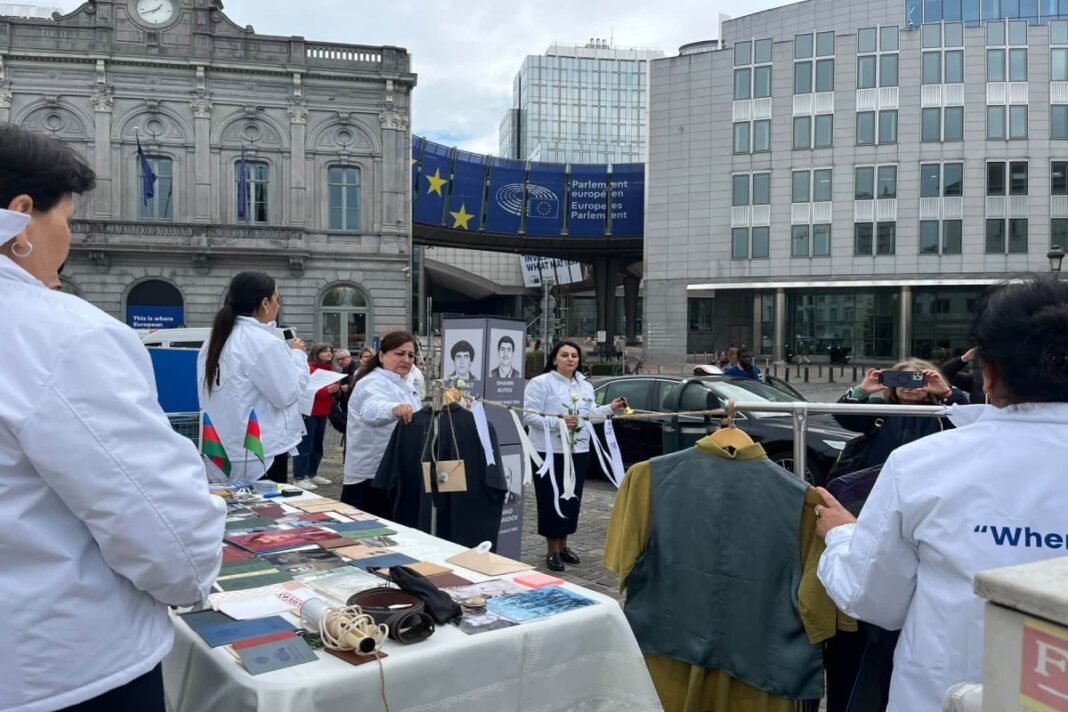 Relatives of missing Azerbaijanis demonstrate outside the European Parliament in Brussels on Oct. 20, 2026.
