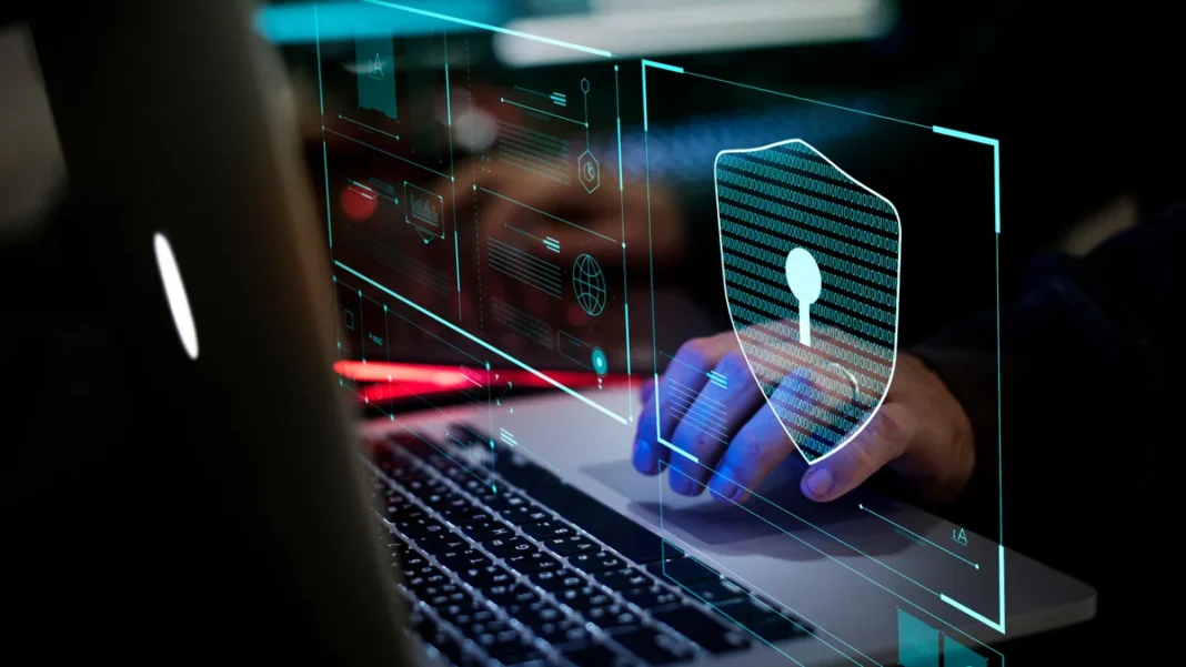 A laptop with a digital security symbol. Illustrative image.