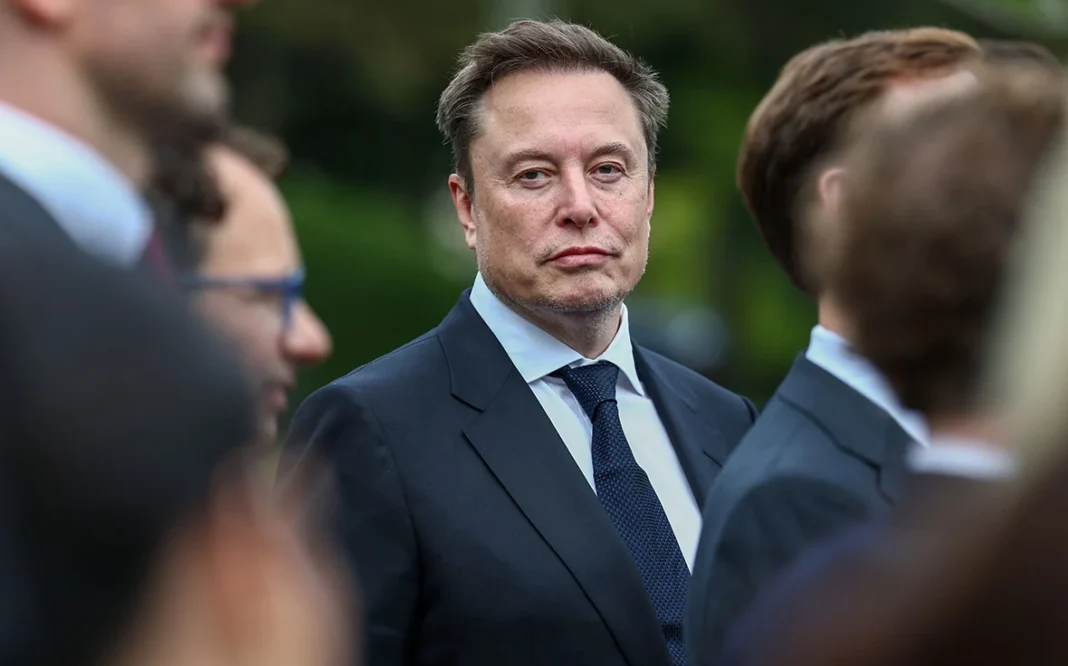 Elon Musk at an outdoor gathering