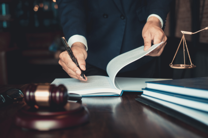 Legal documents and scales of justice illustrating Azerbaijan's free legal aid bill
