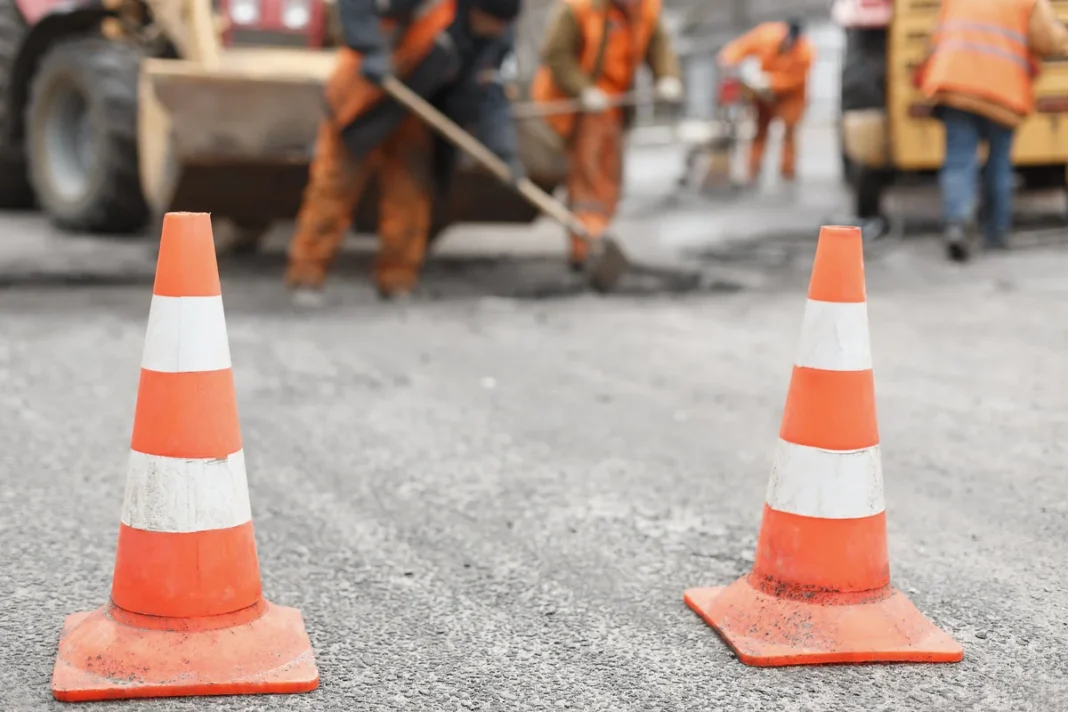 Road cones mark a work zone ahead of planned repairs. Illustrative photograph.