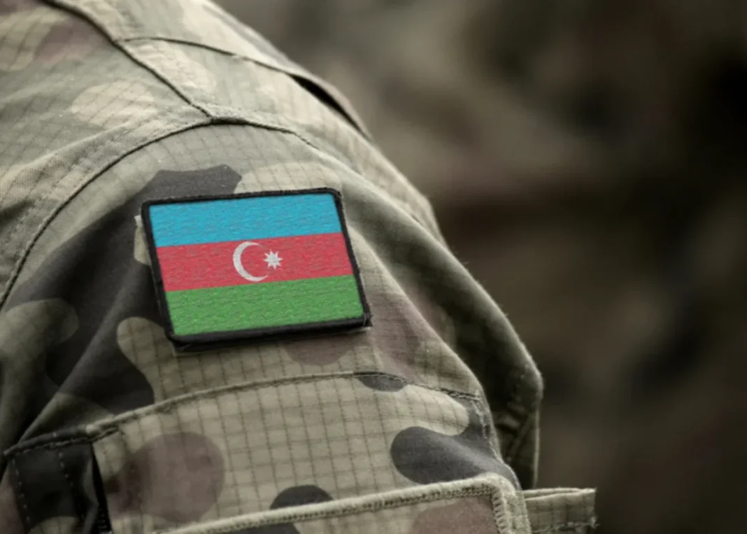 An Azerbaijani flag patch on a military uniform. Illustrative photo.