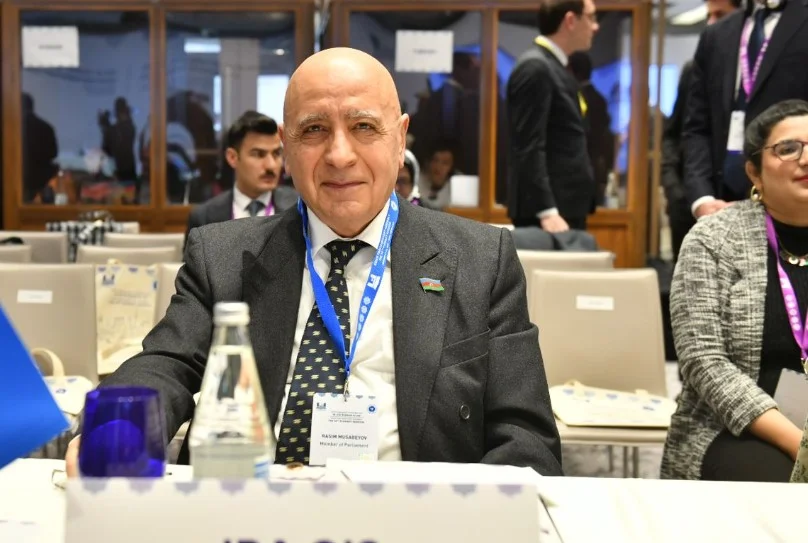 Azerbaijani lawmaker Rasim Musabekov seated at an international meeting