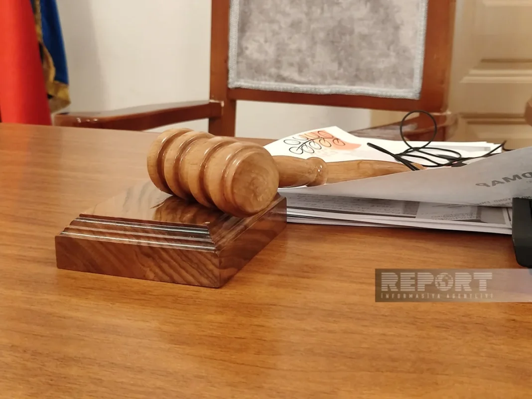 A judge's gavel beside social media symbols