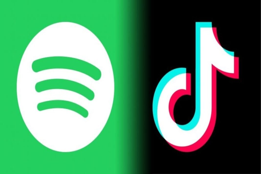 Spotify and TikTok logos displayed on a smartphone